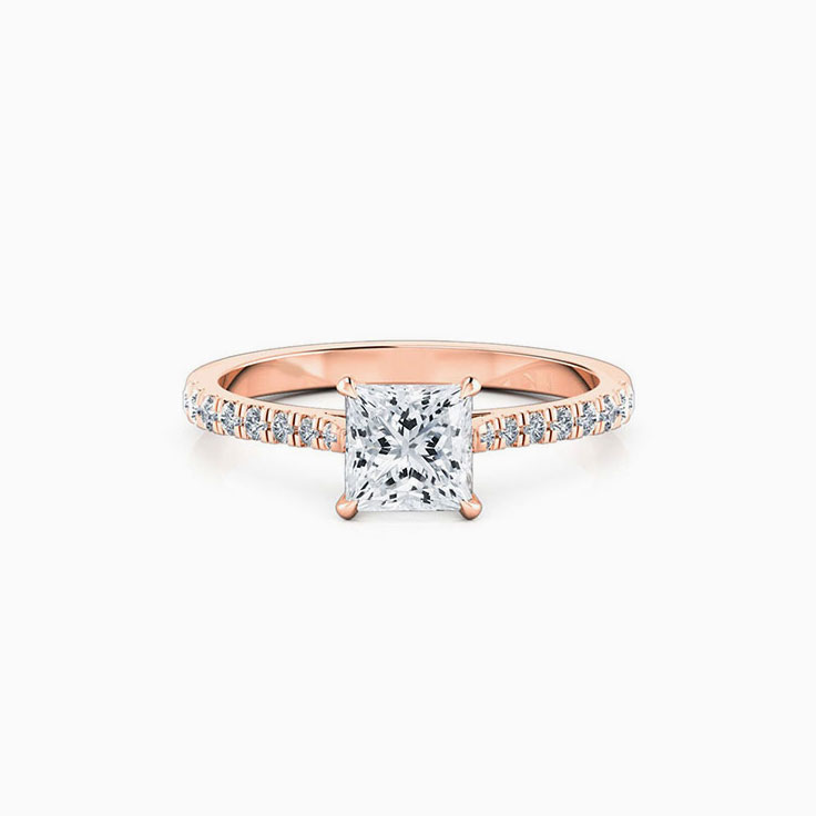 Princess cut diamond in four claw set engagement ring