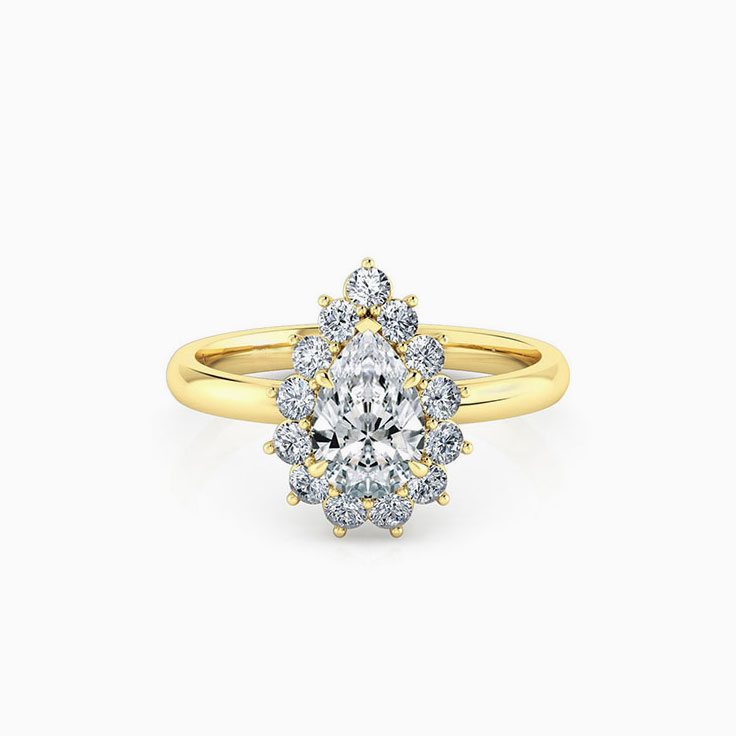 Pear cut diamond engagement ring with a floral diamond halo